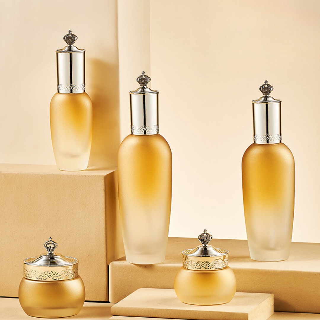 YF291 Luxury Empty Golden Glass Lotion Bottle with Pump and Cream Jar with Lids for Cosmetic Glass Packaging