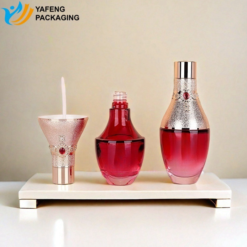 Elegant Glass Bottles with Red Ruby Caps for Beauty Packaging