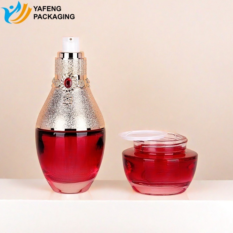 Elegant Glass Bottles with Red Ruby Caps for Beauty Packaging