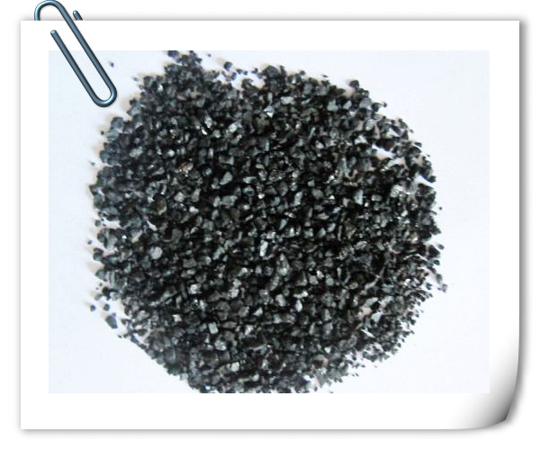 Acid washing low water soluble ash activated carbon