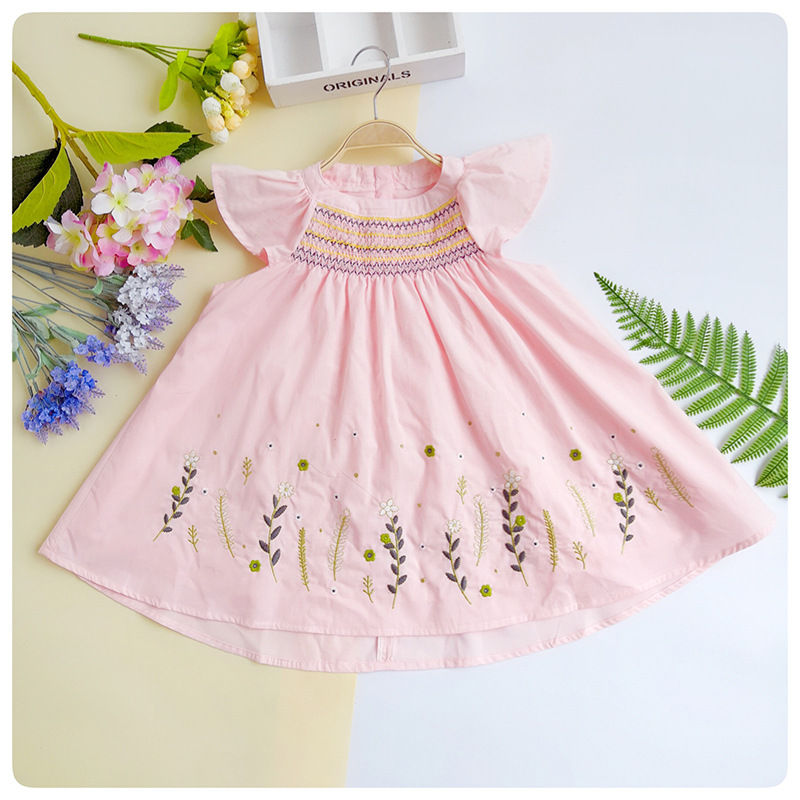 Pink kids smocking  dress with flying sleeves and small wildflowers