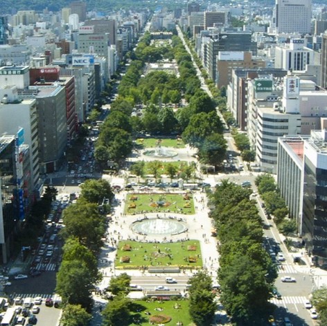 Odori Park is an oasis with 92 types of trees including lilacs and elm stands located in the middle of a business district. On its lawns and around its fountains. 